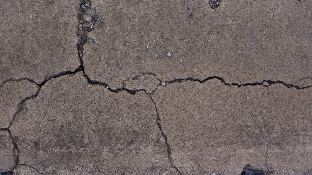 What causes cracking to a home's slab?